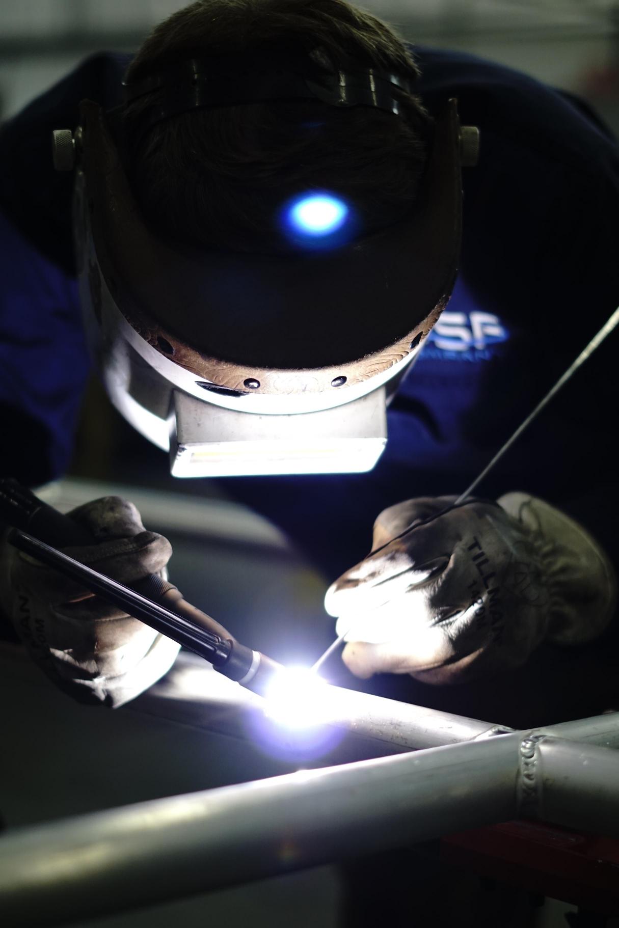 OSF welder laying a TIG weld on stainless pipe